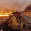 Fire crews battle the Kenneth Fire in the West Hills section of Los Angeles on Thursday.