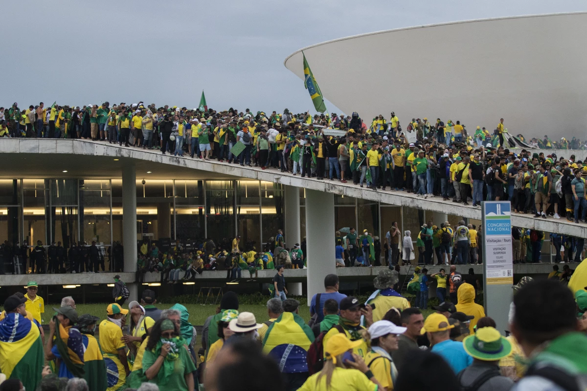 Supporters of former President Jair Bolsonaro clash with security forces as they raid the National Congress in Brasília, Brazil, Jan. 8, 2023.