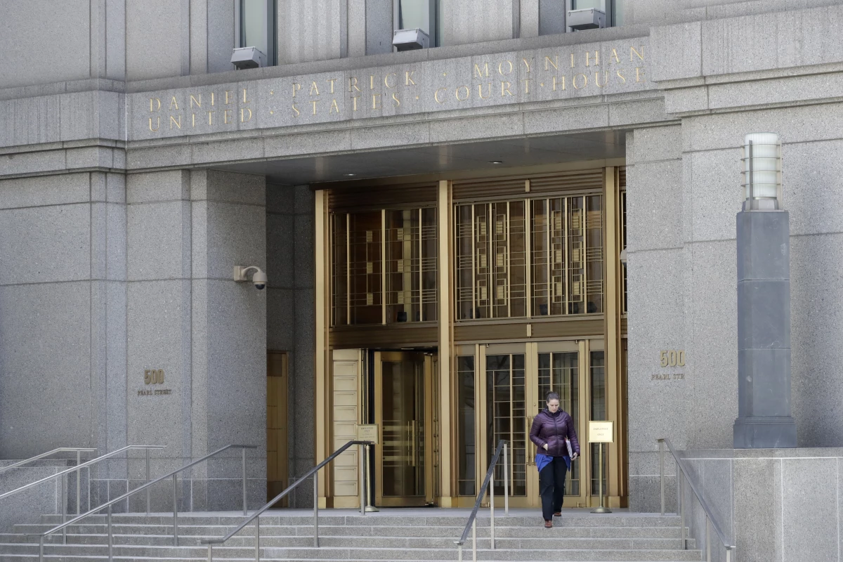 A woman leaves the Daniel Patrick Moynihan United States Courthouse on Nov. 20, 2017, in New York. On an especially cold February day earlier this year, on the 23rd floor of Moynihan Courthouse, Judge Alvin Hellerstein heard arguments to (again) decide whether President Trump could nix his hush money payment conviction.