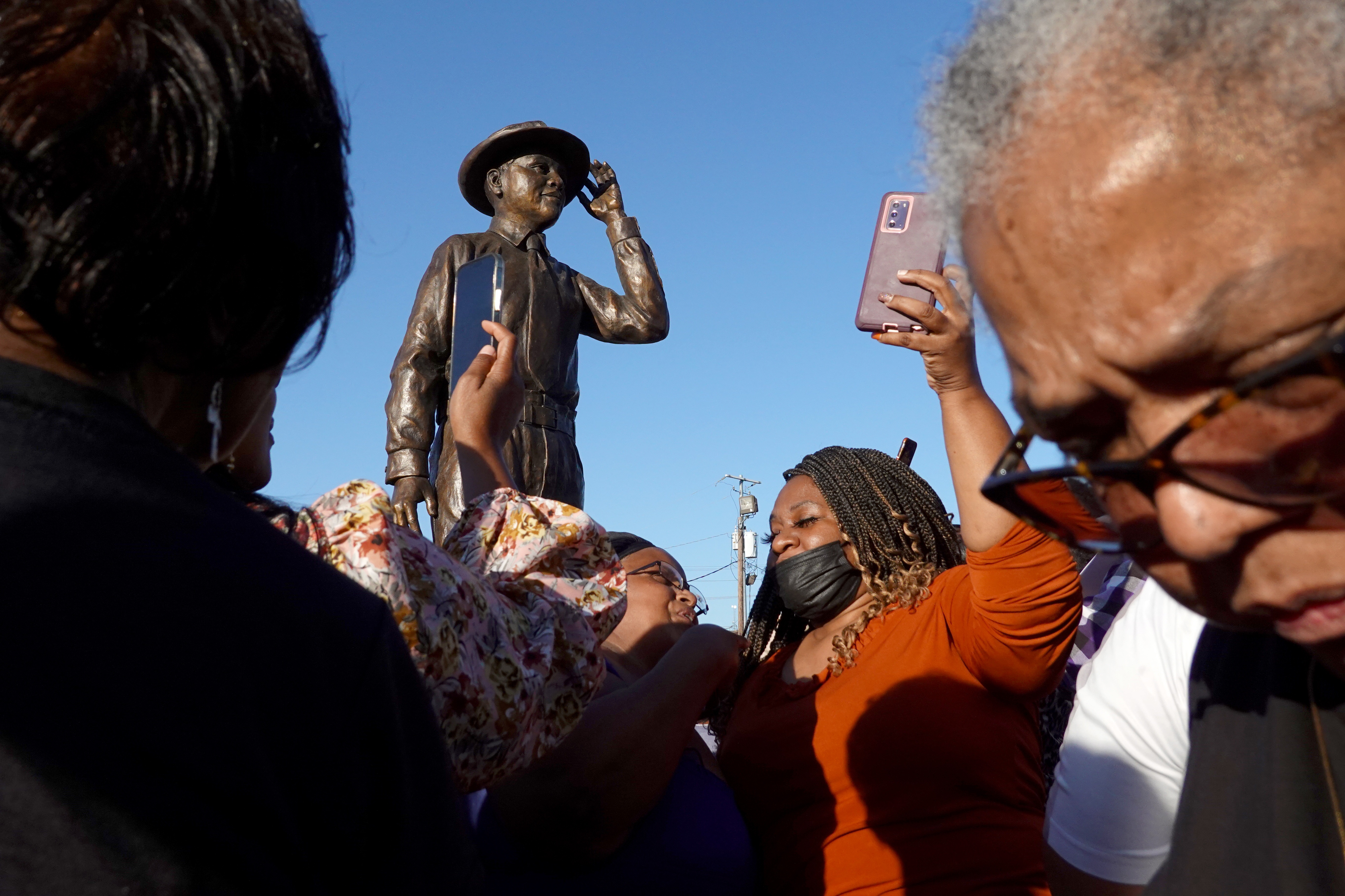 A statue of Emmett Till is unveiled on October 21, 2022, in Greenwood, Miss., in memory of 14-year-old Emmett Till. His 1955 lynching is considered the spark that ignited the civil rights movement.