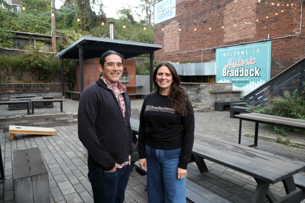 Braddock Public House co-owners Matt Katase (left) and Alaina Webber pose for a portrait on the patio of their restaurant on Oct. 16, 2024.