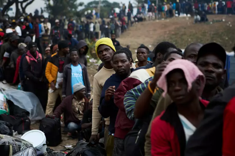 Displaced migrants queue at a deportation site in Durban, South Africa, on June 17.