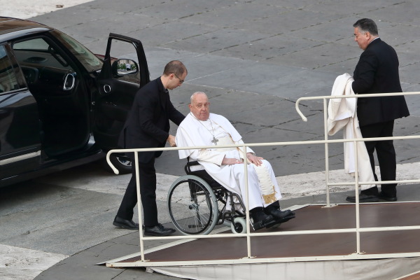 Pope Francis arrives in a wheelchair for the Holy Mass in Saint Peter's Square in Vatican City on Feb. 9.