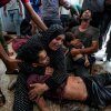 Faten Mreish holds her son's body at a hospital morgue in Deir al-Balah, Gaza Strip, Aug. 28, 2024, after he and others were killed in an Israeli bombardment.