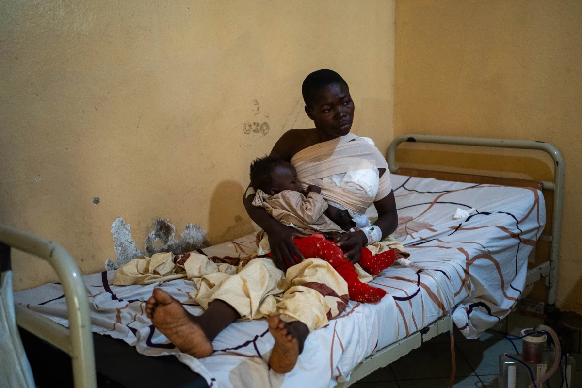 Sifa Kanane, cradles her baby, in Ndosho hospital, Goma, eastern Democratic Republic of Congo.