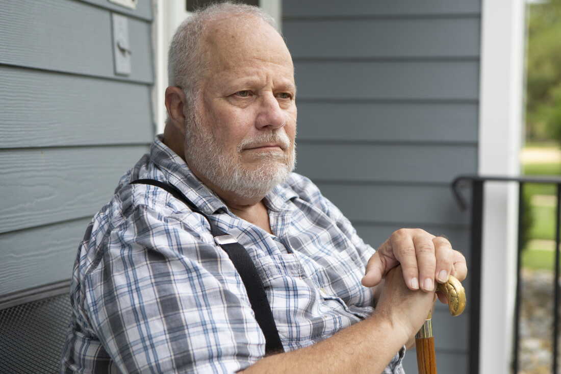Jeff La Marca sits outdoors.