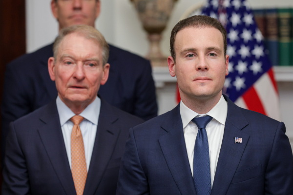 SEC Chair Paul Atkins (left) and CFTC Chair Michael Selig (right) look on during a White House crypto and technology event on Aug. 19, 2026. The Clarity Act would formally split oversight of the crypto sector across the two agencies, although the CFTC could play a larger regulatory role.