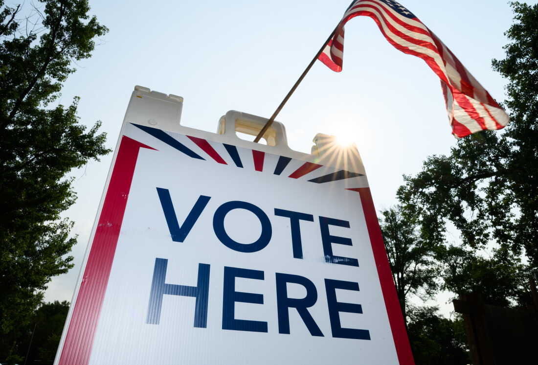 Signage directs voters at a polling place in White Bear Township, Minn., on Aug. 11.