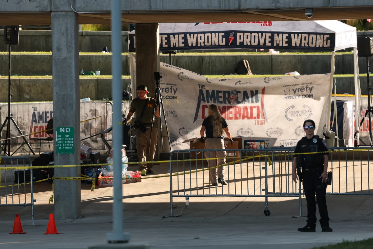 Law enforcement officials work near the crime scene on the campus of Utah Valley University in Orem, Utah on Thursday.