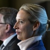 Alternative for Germany (AfD) MP Gerold Otten speaks to the media as co-leader of the far-right party Alice Weidel stands next to him on March 24, 2025 at the Bundestag in Berlin.