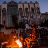 Islamist rebels of Hayat Tahrir al-Sham (HTS) light a fire to keep warm as they guard the abandoned Iranian Embassy just days after toppling Syria's leader, and close ally of Iran, Bashar al-Assad, on Dec. 13, in Damascus, Syria.