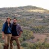 Siblings Marie-Charlotte Piro and Romain Piro stand among some of the olive trees they harvest in Tuscany, Italy, to create their olive oil.