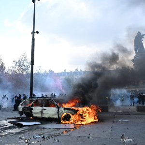A car burns at Place de La Republique during a protest against rising living costs in Paris, on Saturday.