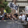 A demonstrator holds up an "8647" sign at a "No Kings" protest in Louisville, Ky., in June 2025.  
