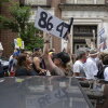 A demonstrator holds up an "8647" sign at a "No Kings" protest in Louisville, Ky., in June 2025. 