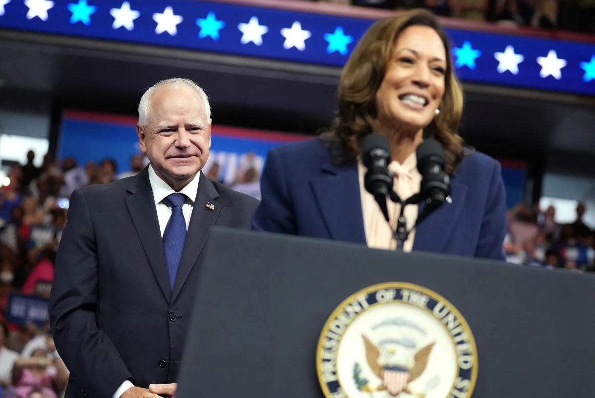 Tim Walz looks on as Vice President Harris speaks during a campaign event on Aug. 6 in Philadelphia. At his upcoming debate against Ohio Sen. JD Vance, Walz will look to frame Harris’ vision for the country, while also having to answer for his own record.