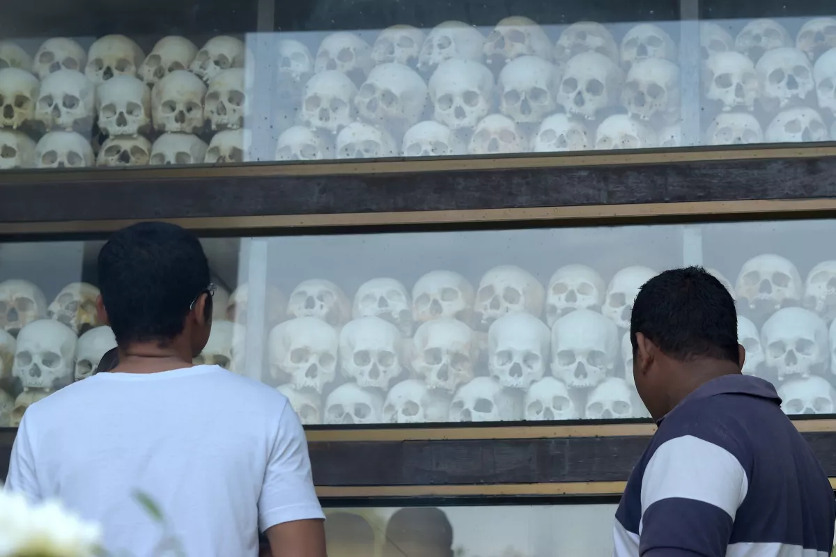 People look at skulls at the Choeung Ek memorial in Phnom Penh, Cambodia in 2018. The location is part of a newly designated World Heritage Site.