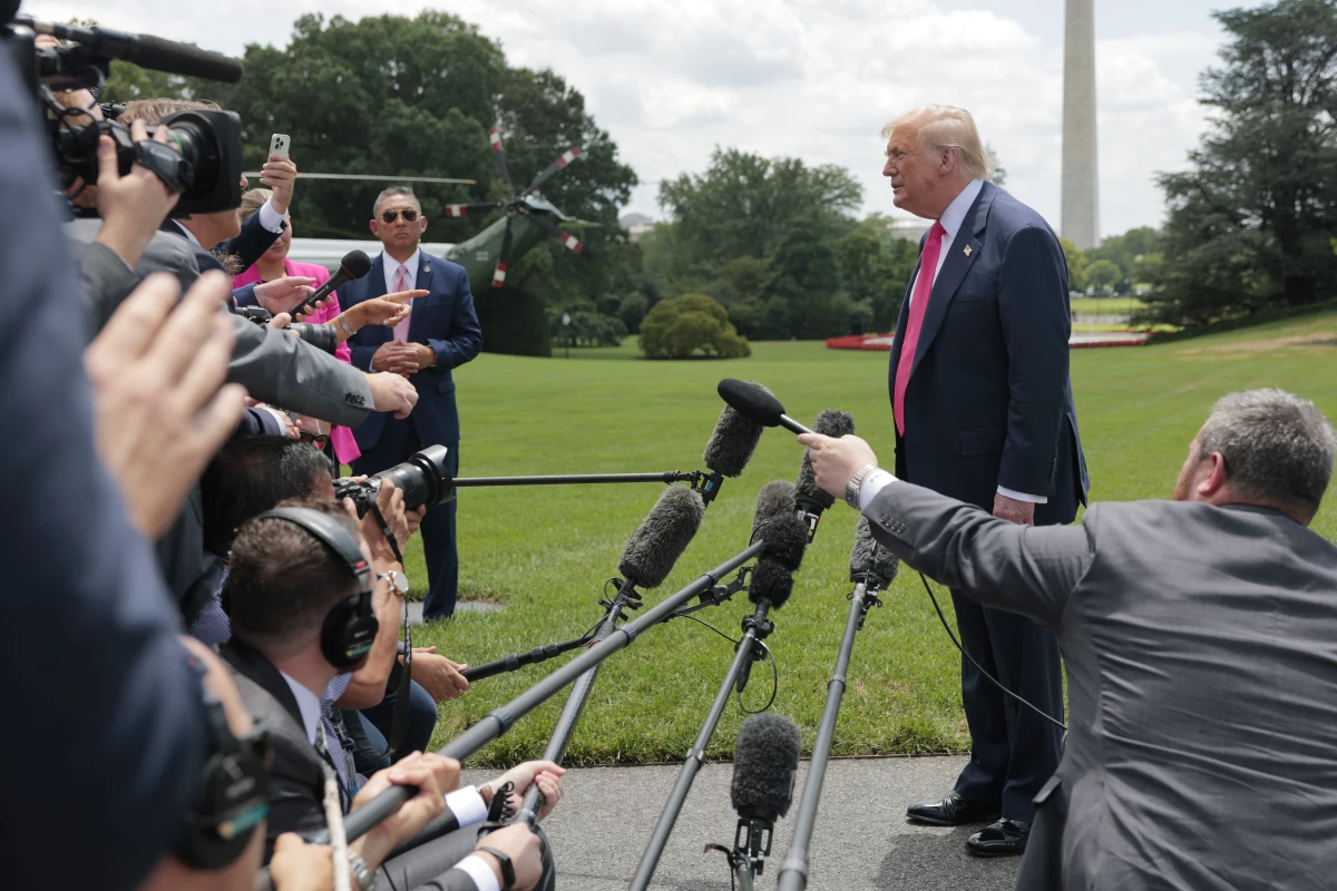 President Trump speaks to the media as he departs the White House on Tuesday for Pittsburgh.