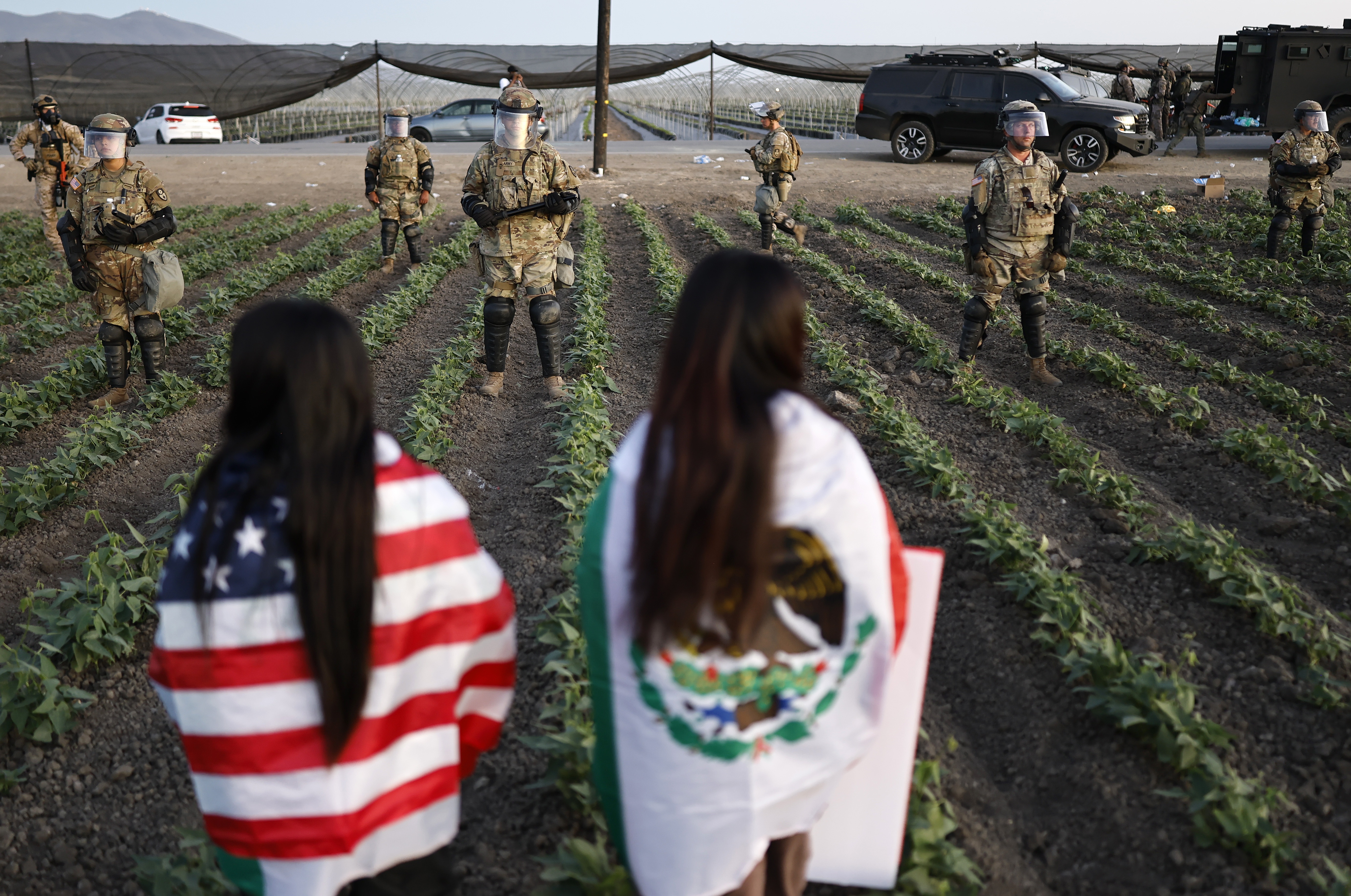 National Guard soldiers block protesters during an ICE immigration raid at a cannabis farm on July 10 near Camarillo, California.