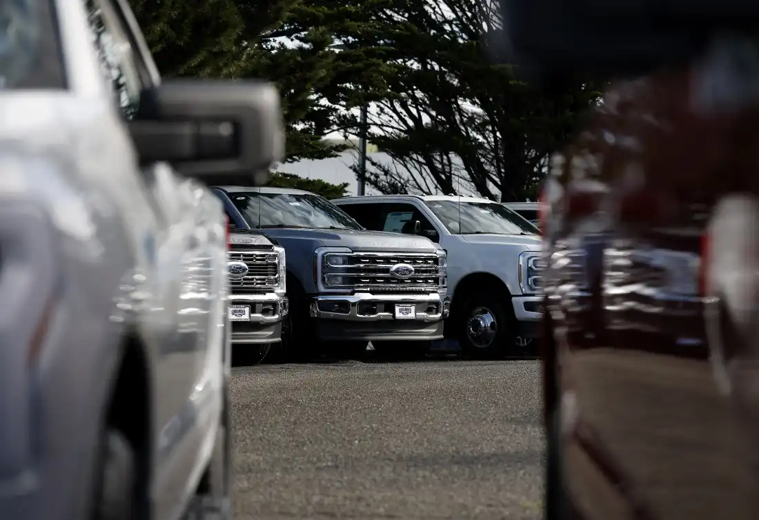 COLMA, CALIFORNIA - JANUARY 06: Ford pickup trucks are displayed on the sales lot at Serramonte Ford on January 06, 2026 in Colma, California.
