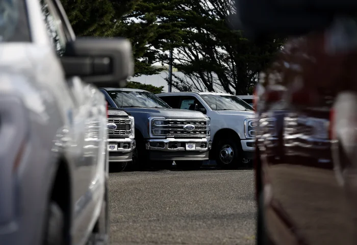 COLMA, CALIFORNIA - JANUARY 06: Ford pickup trucks are displayed on the sales lot at Serramonte Ford on January 06, 2026 in Colma, California.