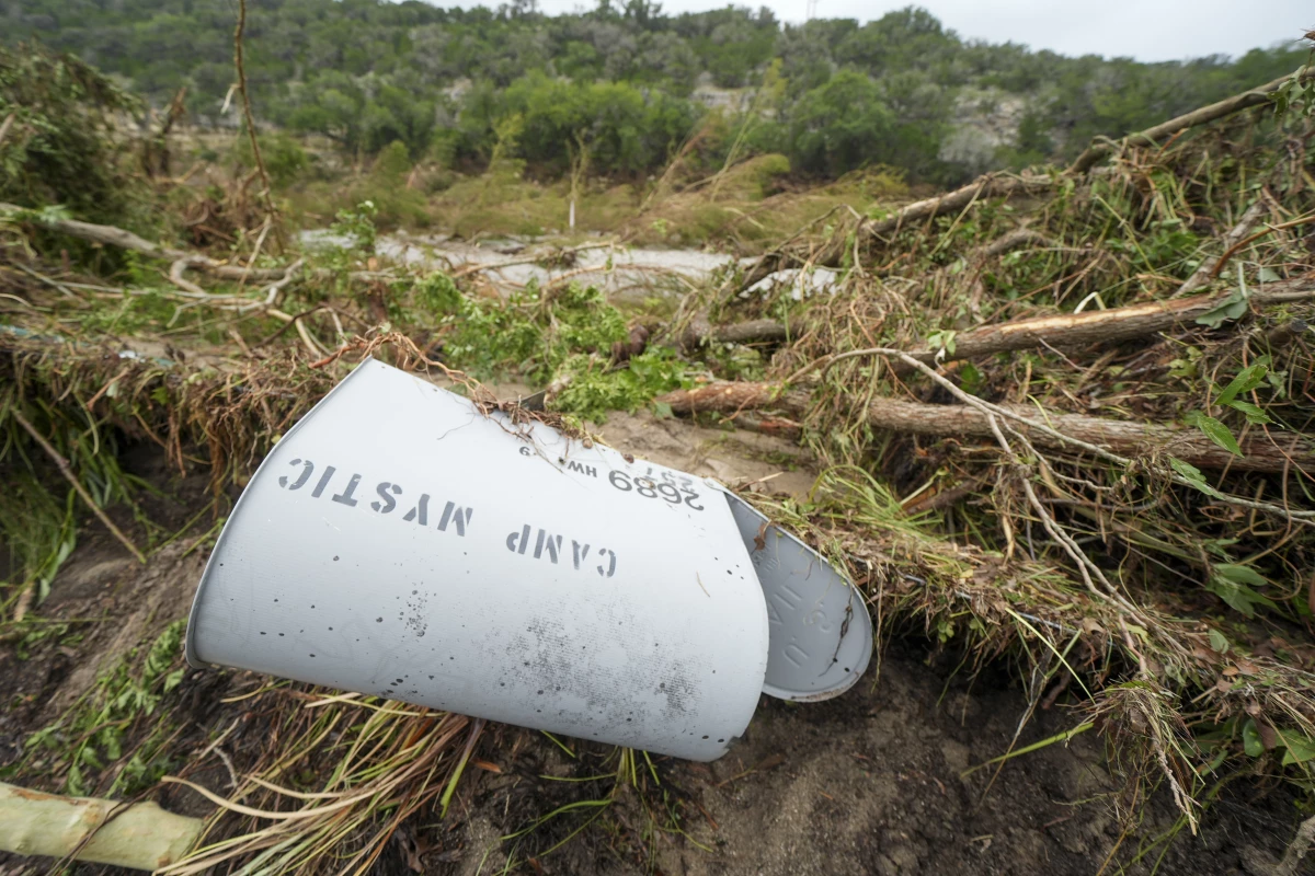 A Camp Mystic mailbox is seen near the entrance to the establishment along the banks of the Guadalupe River after a flash flood swept through the area .