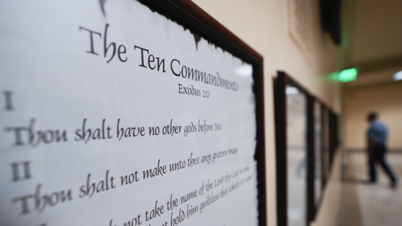 A copy of the Ten Commandments is posted along with other historical documents in a hallway at the Georgia Capitol in Atlanta on June 20, 2024. On Friday, a panel of federal appellate judges ruled that a Louisiana law requiring the Ten Commandments to be posted in the state’s public school classrooms is unconstitutional.