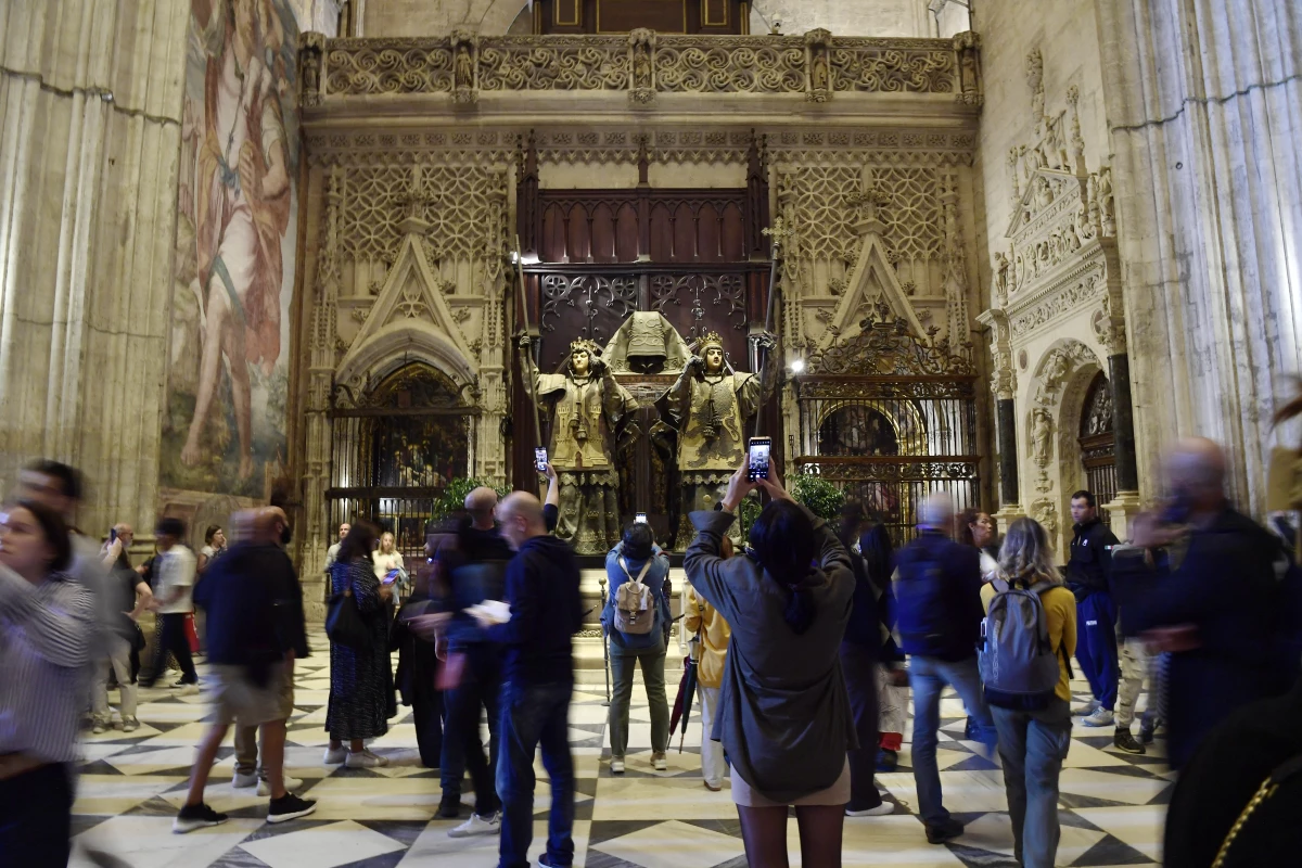 People visit the tomb of Christopher Columbus at the Cathedral of Seville on October 11.