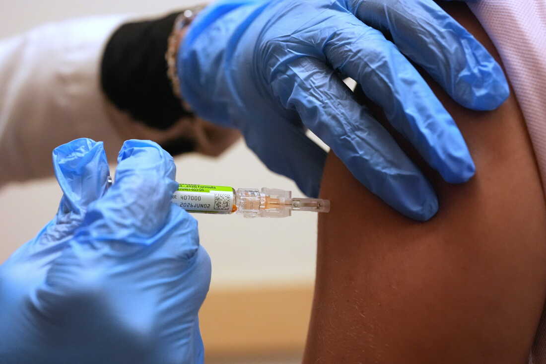 Pharmacy manager Aylen Amestoy administers a patient with a seasonal flu vaccine at a CVS Pharmacy in Miami, Tuesday, Sept. 9, 2025.