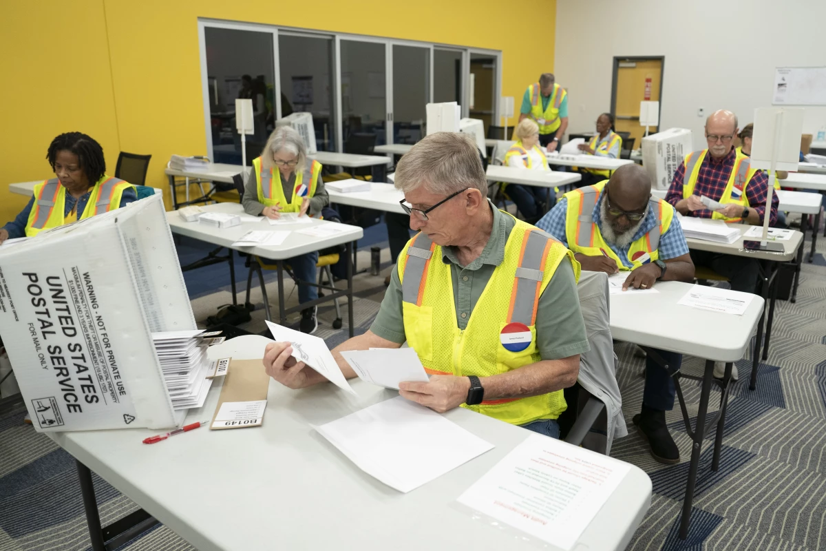Workers for the Wake County Board of Elections in Raleigh, N.C., prepare to mail out absentee ballots in September 2024. Overseas voters who were born abroad and have never lived in North Carolina are now no longer allowed to cast ballots in state and local elections.