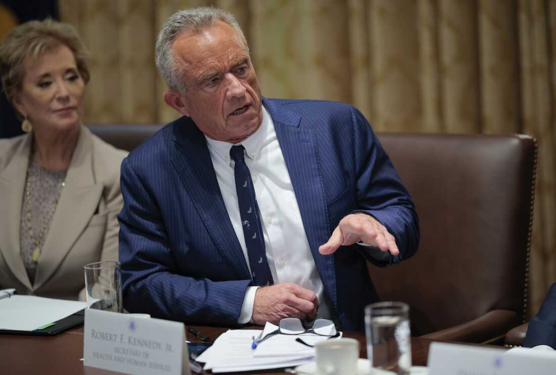 Health Secretary Robert F. Kennedy Jr. and Education Secretary Linda McMahon are pictured. Kennedy is speaking; McMahon is on the left.