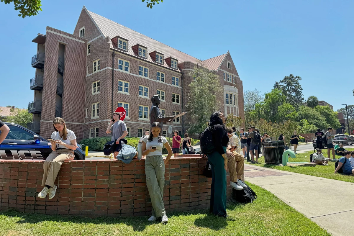 Florida State University students wait for news amid an active shooter incident at the school's campus in Tallahassee, Fla., on Thursday.