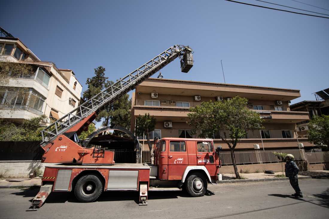  The White Helmets use a crane in Damascus on March 31.