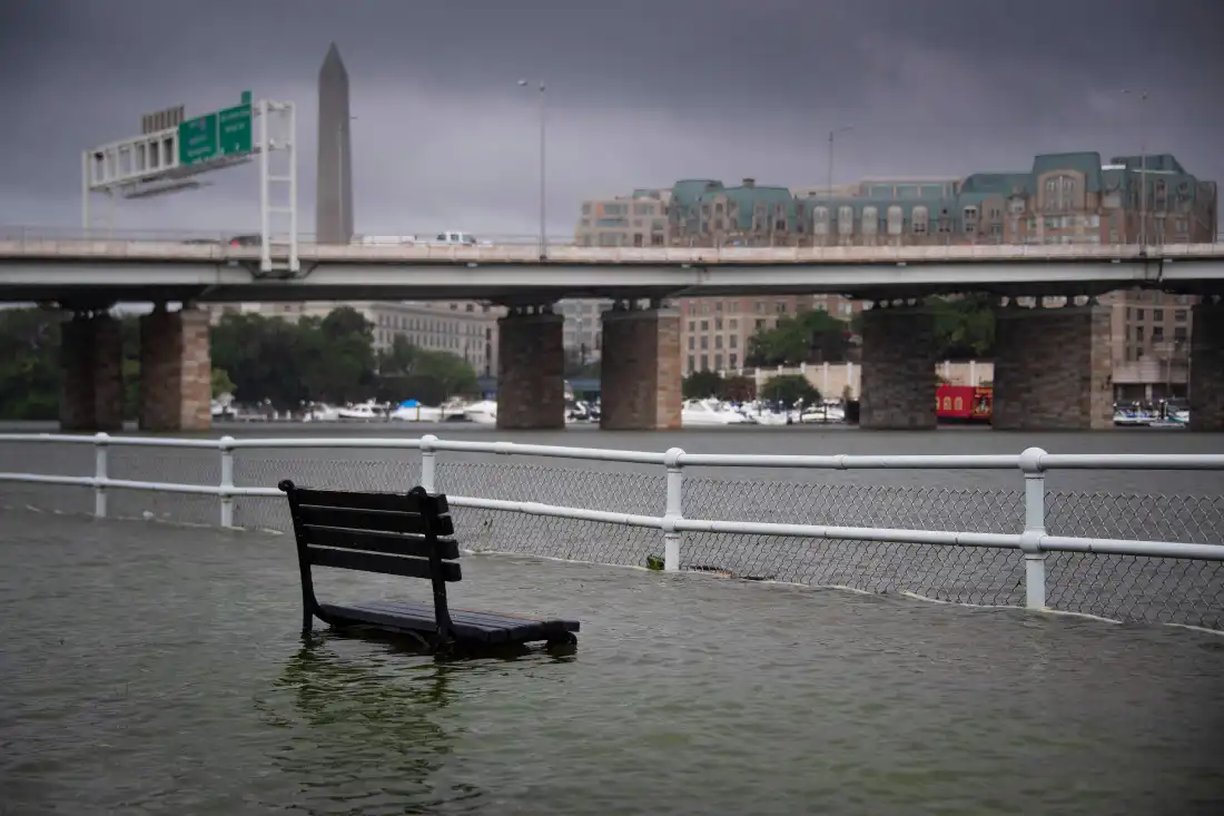 An East Potomac park bench sits underwater after a storm in July 2019.