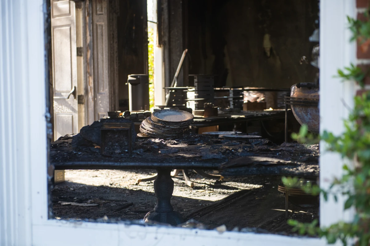 Fire damage is seen inside the Pennsylvania governor's residences following a suspected arson attack Sunday. Police have charged Cody Balmer with attempted murder and other crimes.