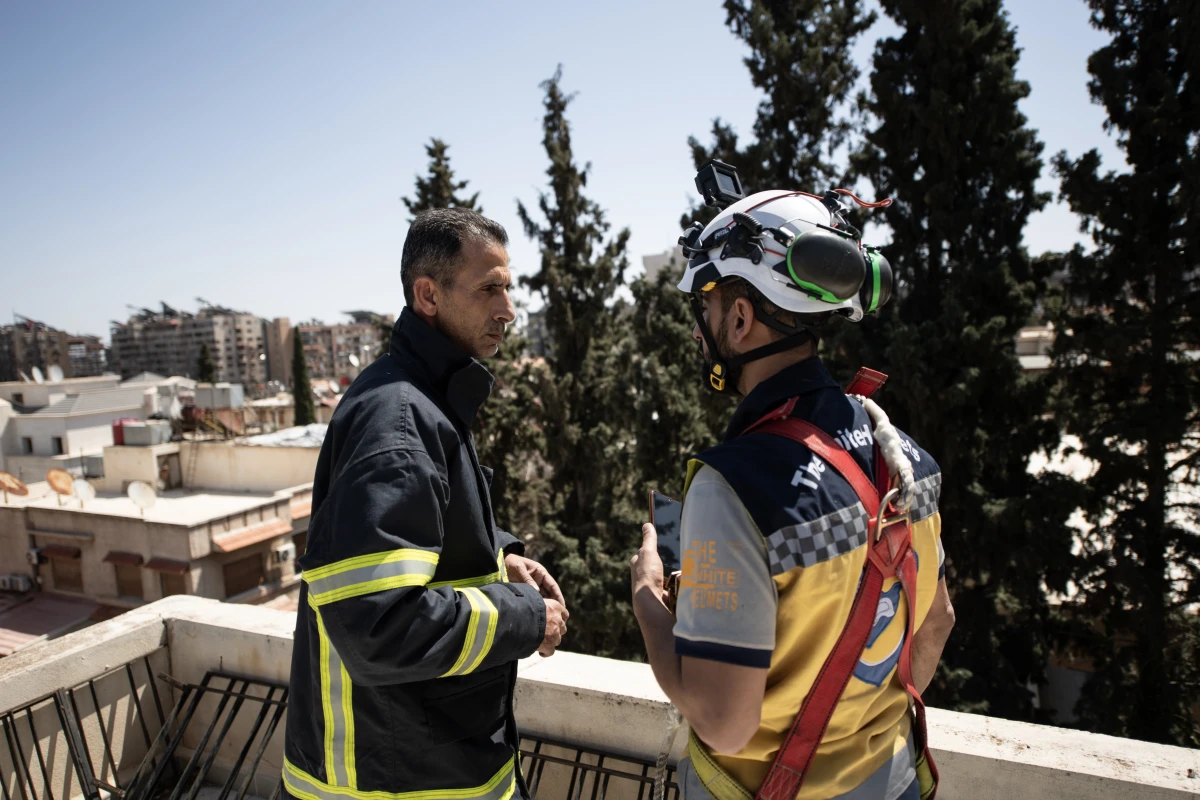 Firefighter Naser Brjas and White Helmet member Kinan Ali respond to an emergency call in Damascus on March 31, 2025.