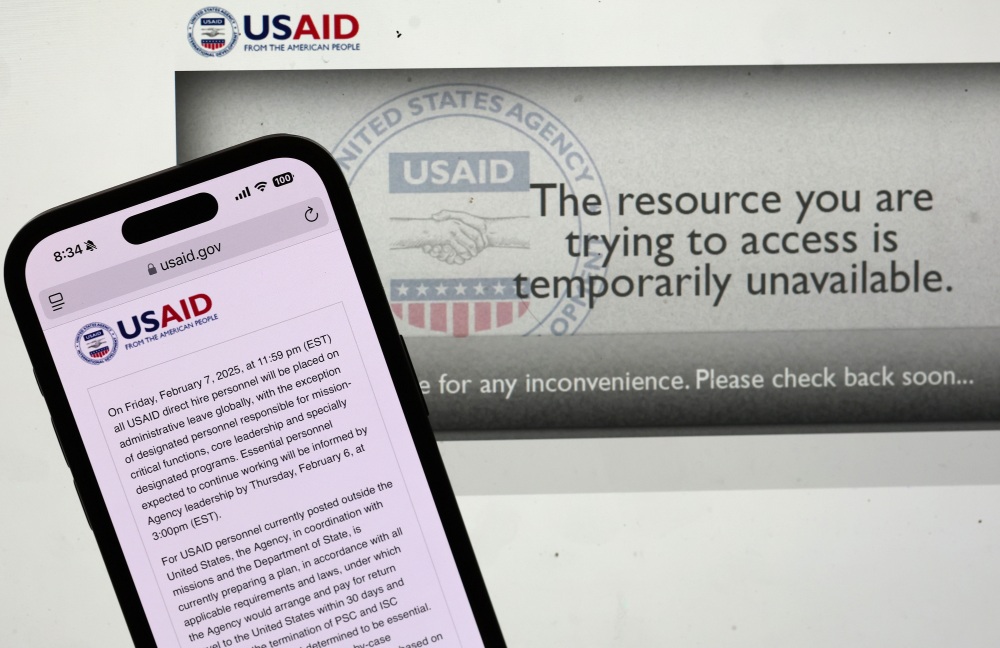 In this photo illustration, a message appears on the U.S. Agency for International Development (USAID) website on Feb. 5. The Trump administration issued a directive late Tuesday night that all USAID direct hire personnel will be placed on administrative leave globally Friday at midnight. (Getty Images)