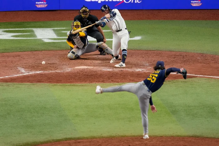 Tampa Bay Rays second baseman Ben Williamson connects for a game-winning RBI single off Milwaukee Brewers pitcher Shane Drohan during the 12th inning of Game 4 of baseball