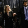Former Theranos CEO Elizabeth Holmes and her partner, Billy Evans, following a hearing at the Robert E. Peckham U.S. Courthouse on March 17, 2023 in San Jose, California. Evans has raised millions of dollars for a new health tech startup that Holmes is advising him on.