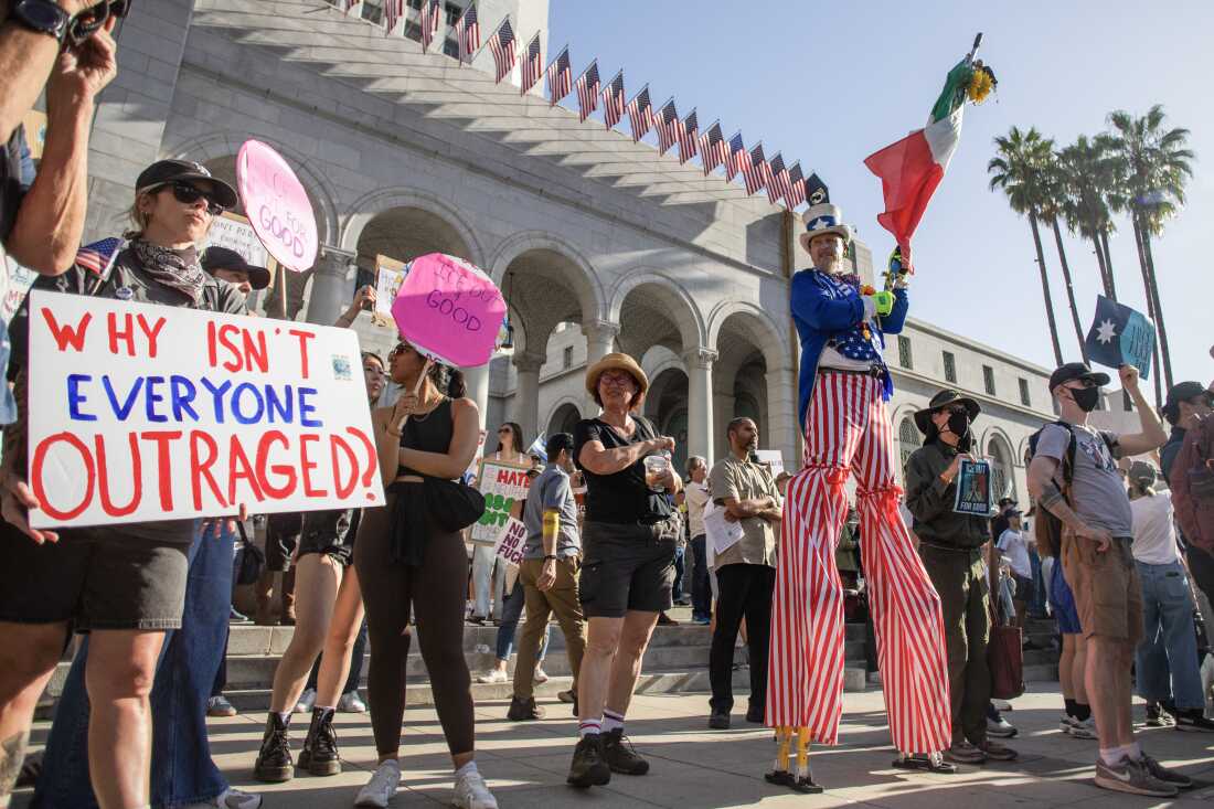 Protesters demonstrate against federal immigration actions at an "ICE Out of Everywhere" rally in front of City Hall in downtown Los Angeles on January 31.