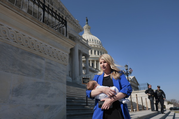 U.S. Rep. Brittany Pettersen, Dem.-Colo., holds her 1-month old baby as she departs during a series of votes at the Capitol on March 11, 2025 in Washington, D.C.
