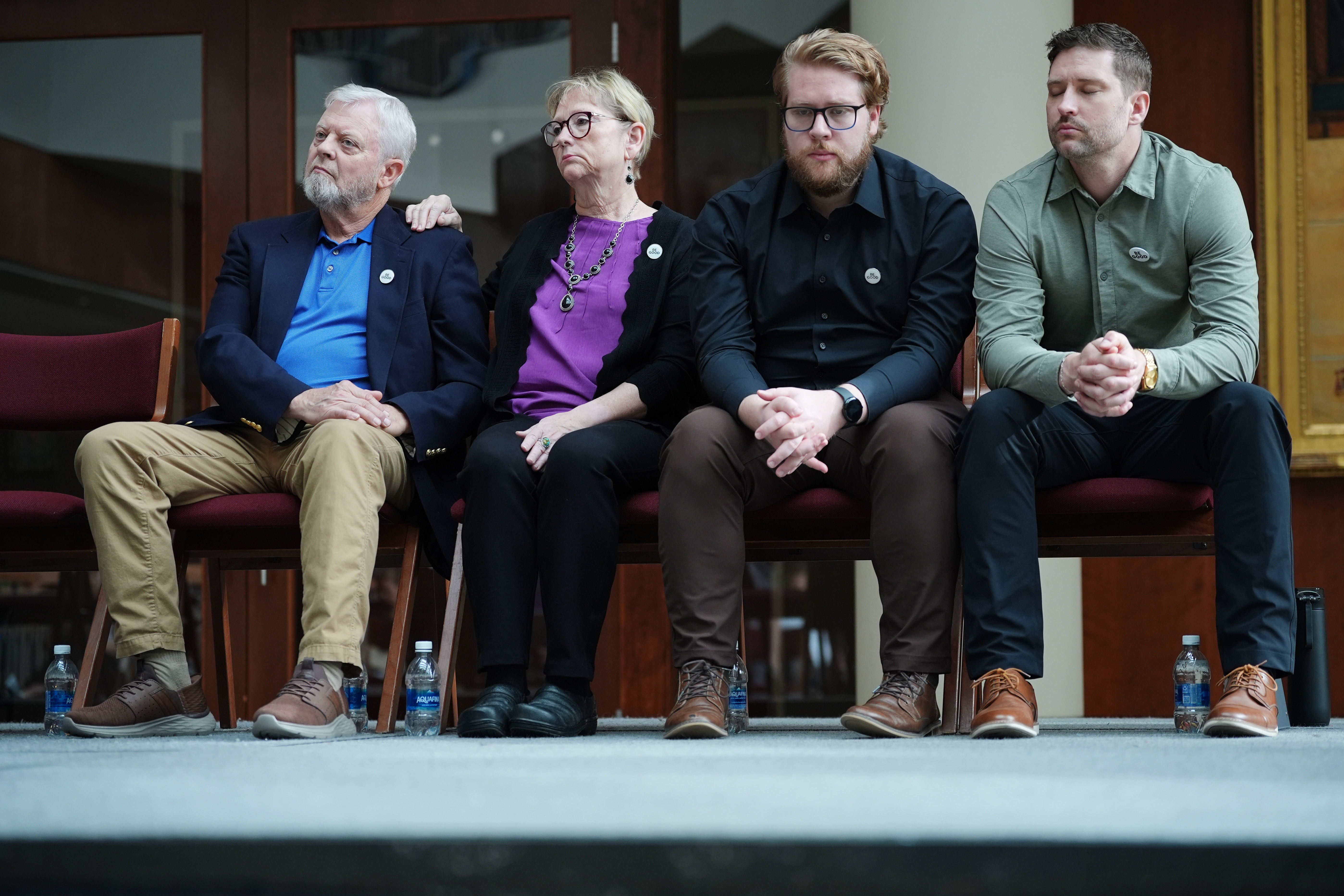 The family of Renee Good, from left; father Tim Ganger, mother Donna Ganger, brother Luke Ganger and brother Brent Ganger, listen during a news conference after the family sued the U.S. government and several immigration officials, Thursday, Oct. 1, 2026, in Minneapolis.