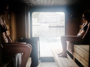 Sanna Bendiksen Landhaug (left) and Ida Hellum Reppen take an early morning sauna at Sukkerbiten in Oslo, Norway. Sukkerbiten is the Oslo Sauna Association's cluster of many small saunas in a variety of styles, lined up along a pier.