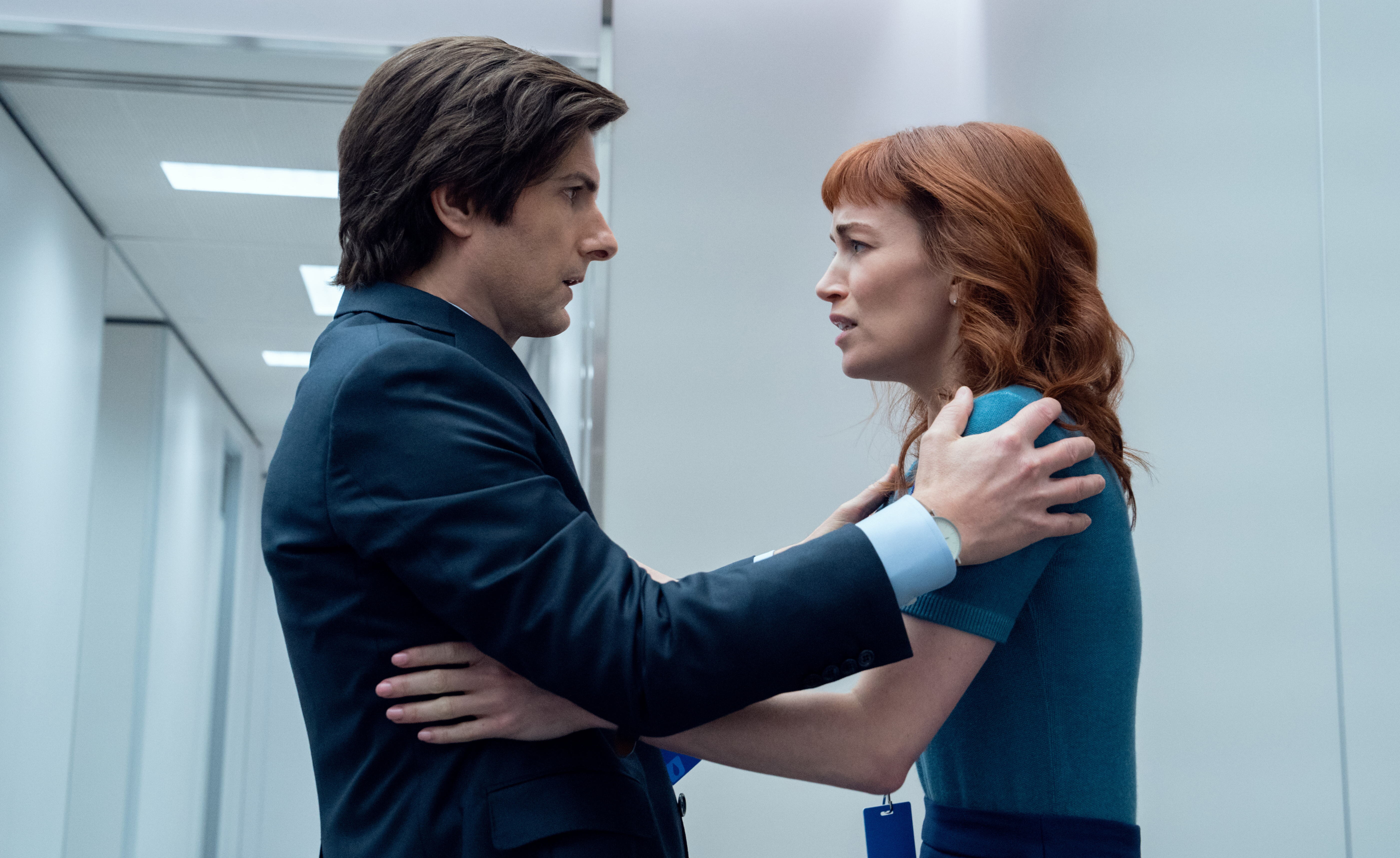 The Apple TV+ series <em>Severance</em> returns for a second season on Friday, Jan. 17. Above, Adam Scott as Mark and Britt Lower as Helly.