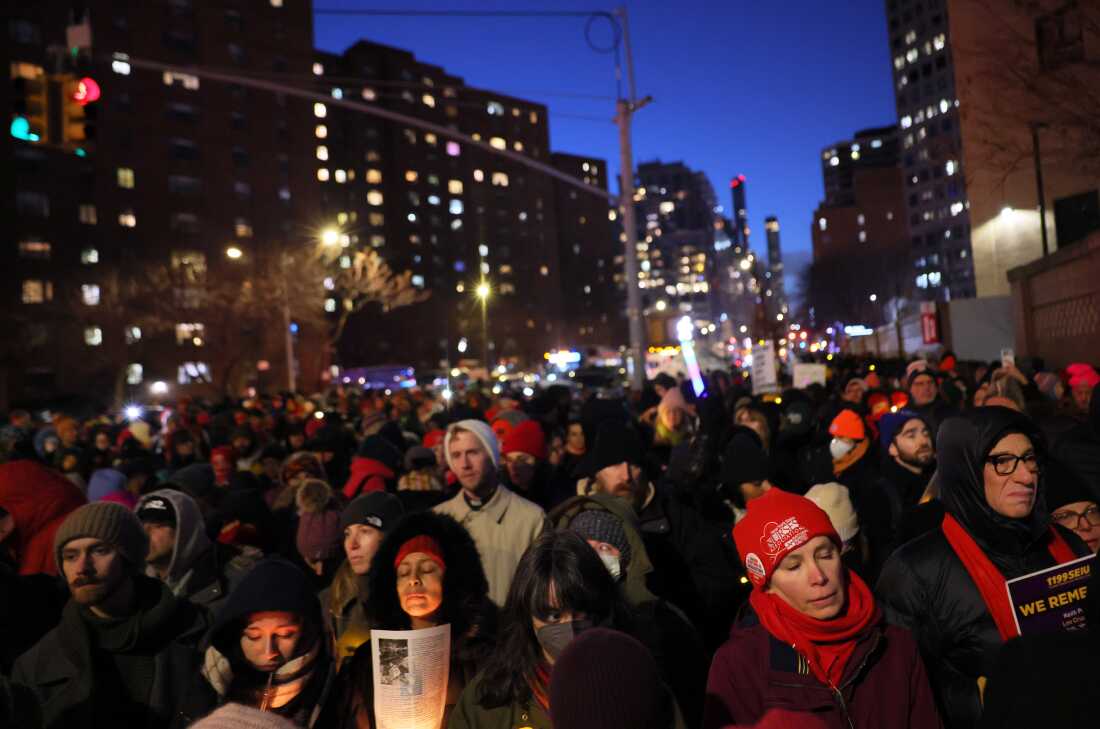 Healthcare workers attend a vigil for VA nurse Alex Pretti at VA NY Harbor Healthcare System Thursday in New York City.