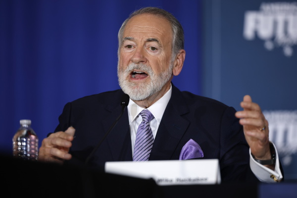 Former Arkansas Gov, Mike Huckabee moderates a roundtable discussion with Donald Trump at the Drexelbrook Catering & Event Center on Oct. 29 in Drexel Hill, Pa.