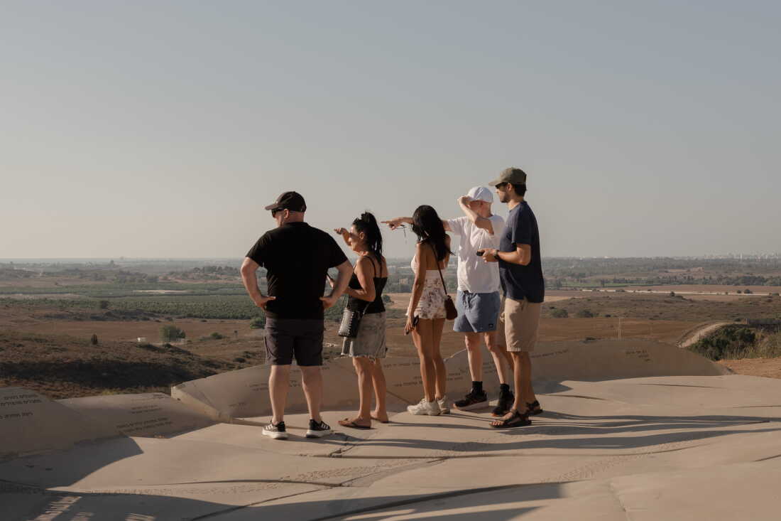SDEROT, ISRAEL, SEPTEMBER 01, 2026: People on hill overlooking the border between Israel and Gaza. Credit: Amit Elkayam for NPR.