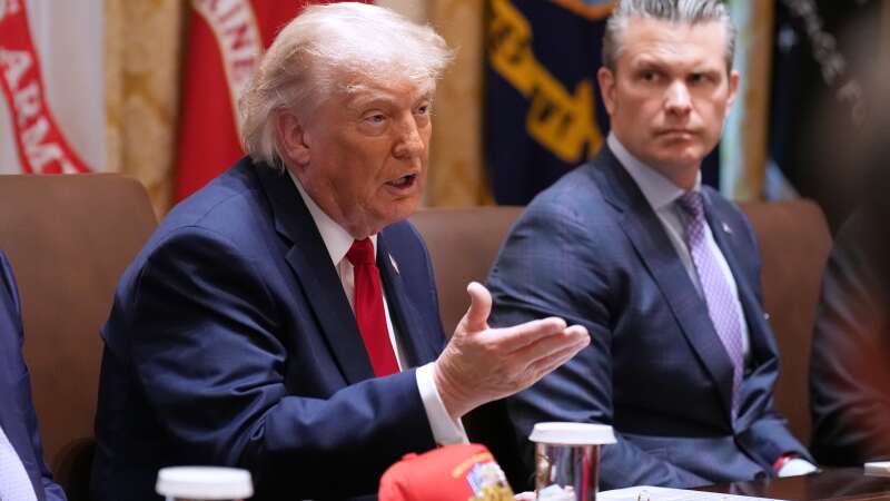 President Donald Trump speaks during a Cabinet meeting at the White House, Wednesday, May 27, 2026, in Washington, as Secretary of Defense Pete Hegseth, looks on.