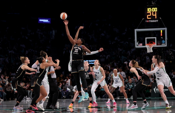 Jonquel Jones #35 of the New York Liberty and Kayla McBride #21 of the Minnesota Lynx tip off to start Game Five of the WNBA Finals on Sunday. The Liberty defeated Minnesota in overtime to win the championship. Now the league's Players Association has opted out of its contract to secure higher pay.