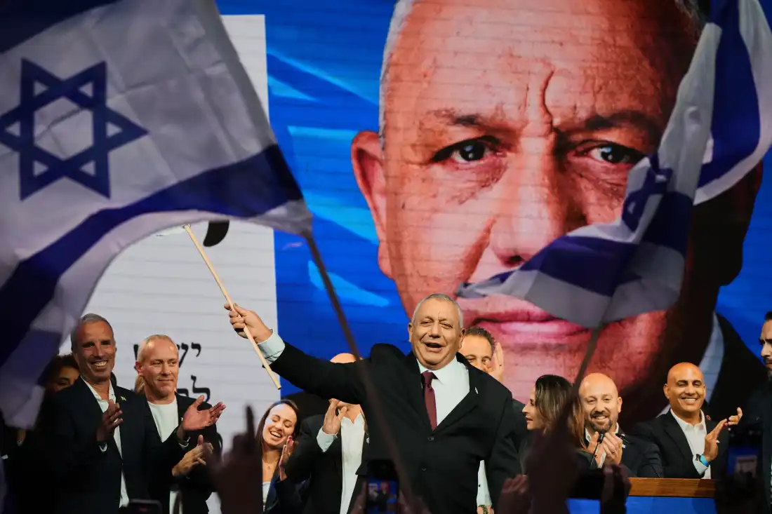 Gadi Eisenkot, leader of the Yashar ("Straight") party, waves an Israeli flag onstage following the release of the first exit poll results in Israel's general election in Tel Aviv, Israel, Wednesday, Oct. 28, 2026.
